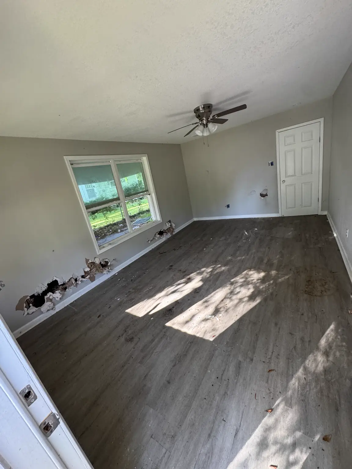 Same Alexandria living room after household debris was removed